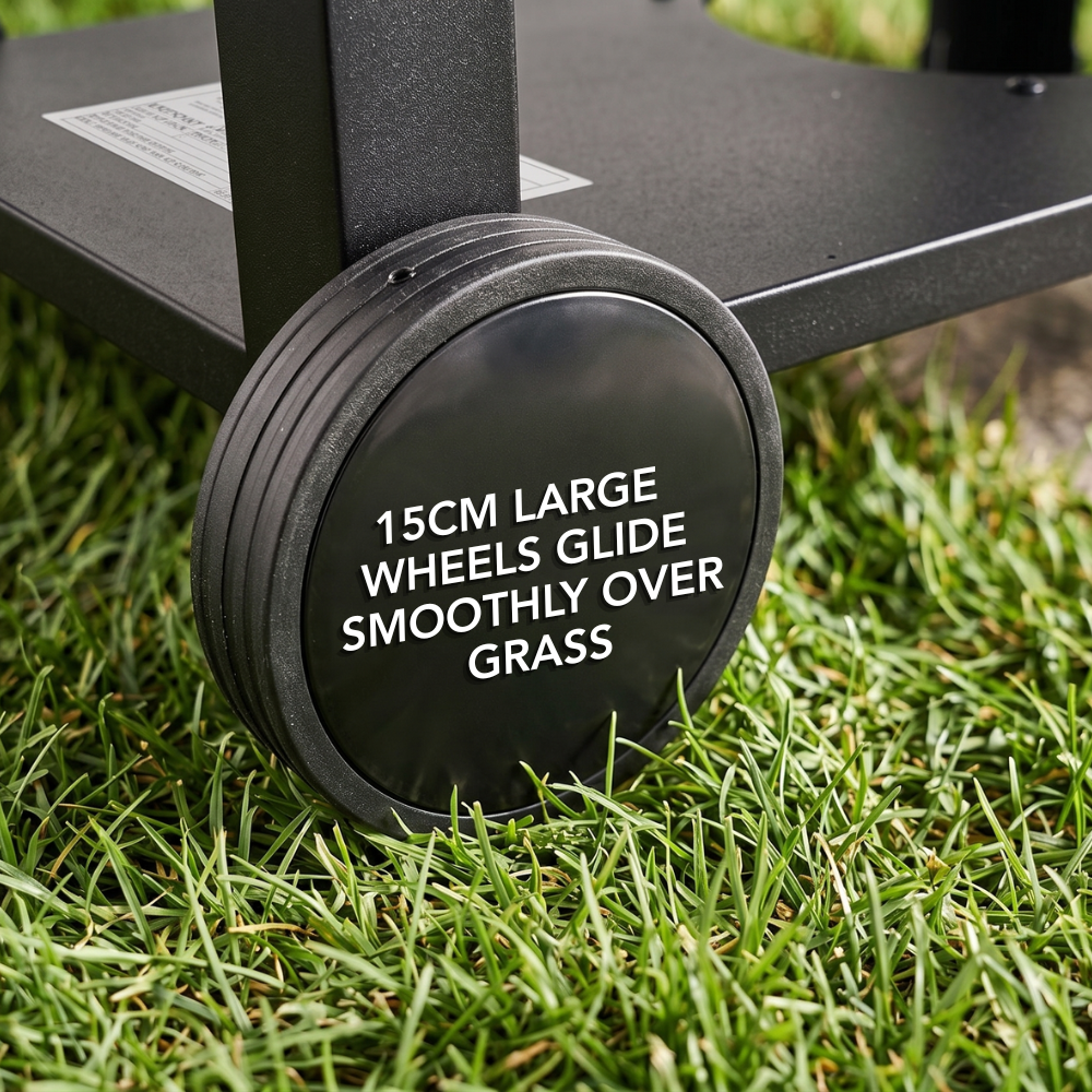 Close-up of the large wheels on the portable Wabaya Max Gas BBQ on green grass